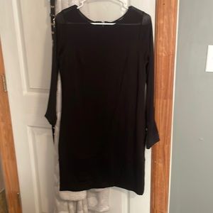 Long sleeve black dress. See through around the shoulder area